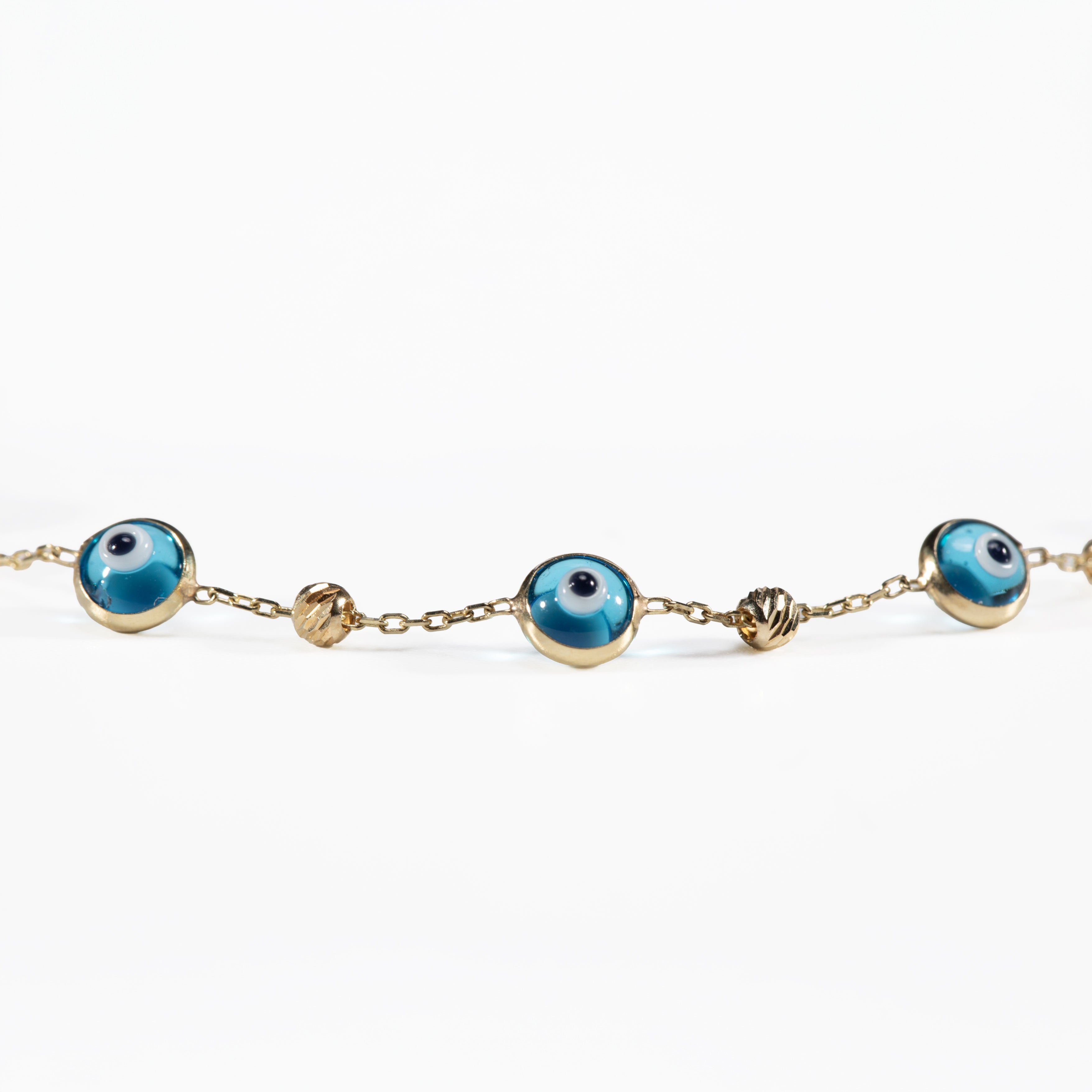 10K Gold Eye Bracelet with Diamond-Cut Beads