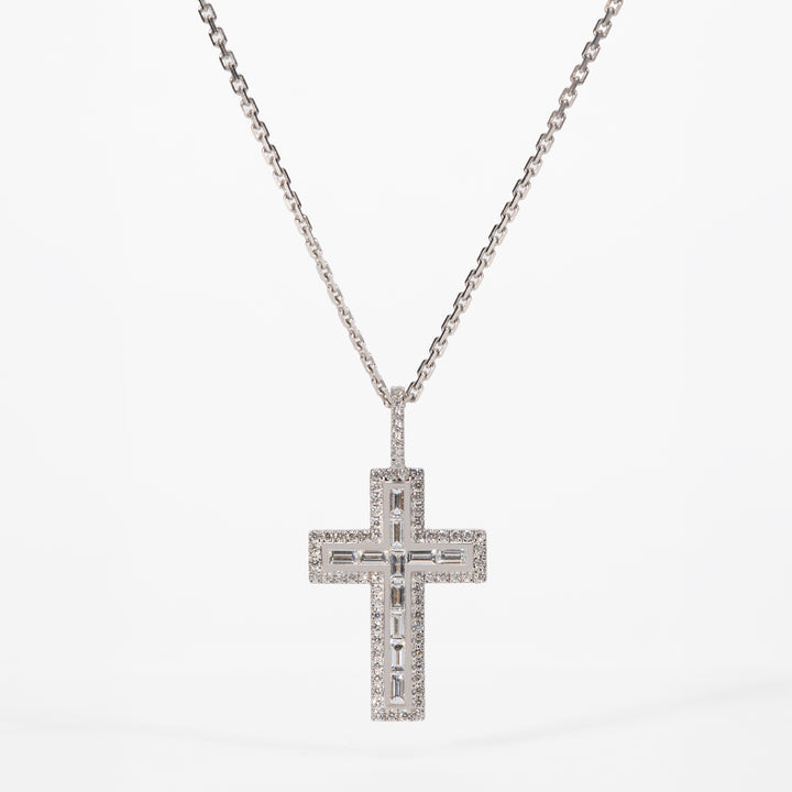 Diamond cross pendant necklace on a white background