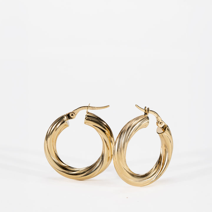 Textured Gold hoop earrings on a white background