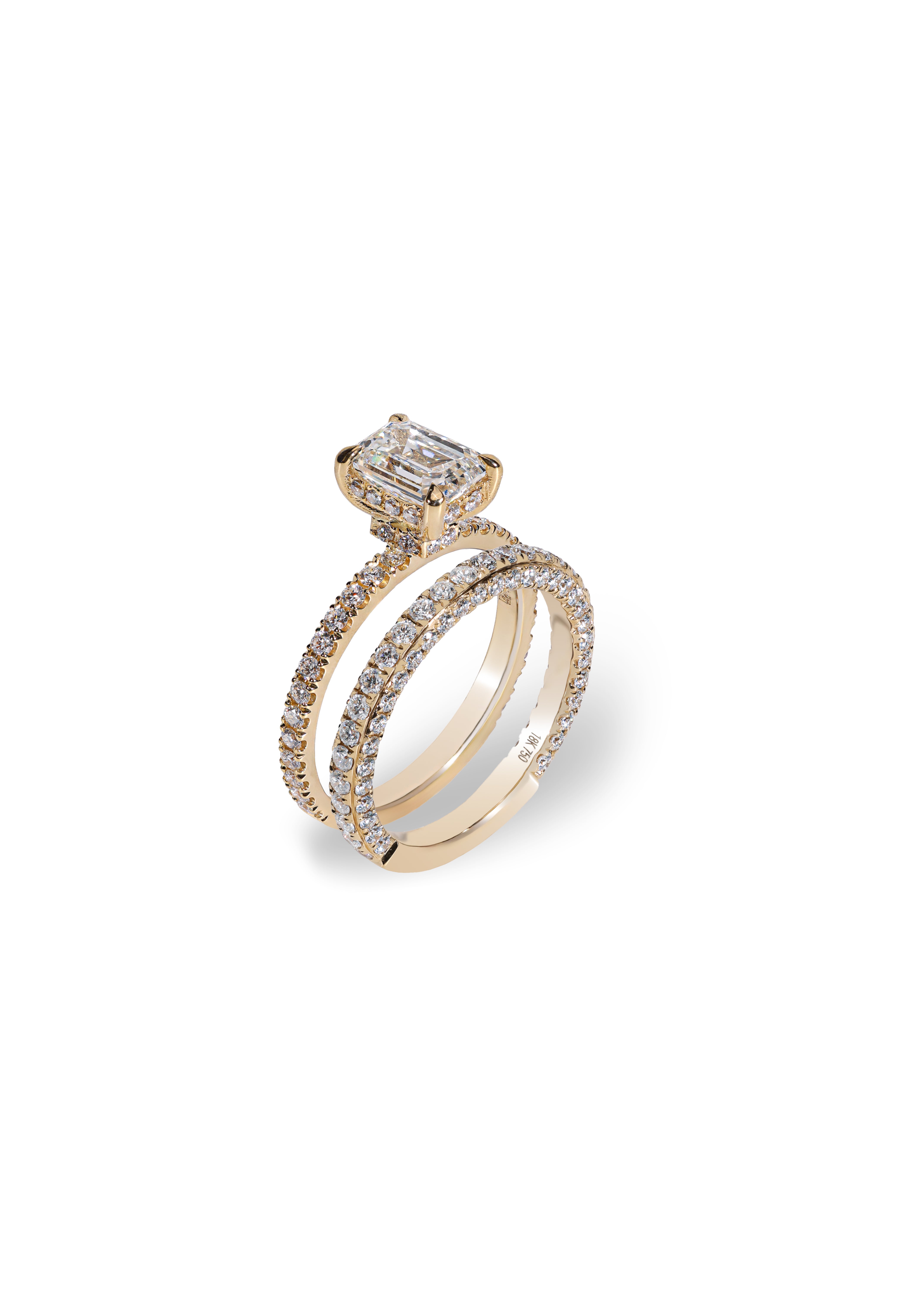 Aurelle emerald engagement ring and 3D diamond wedding band shown together in 18K yellow gold; each piece sold separately.