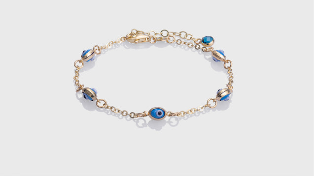 10K Yellow Gold Kids Adjustable Bracelet With 5 Oval Baby Blue Eye Charms