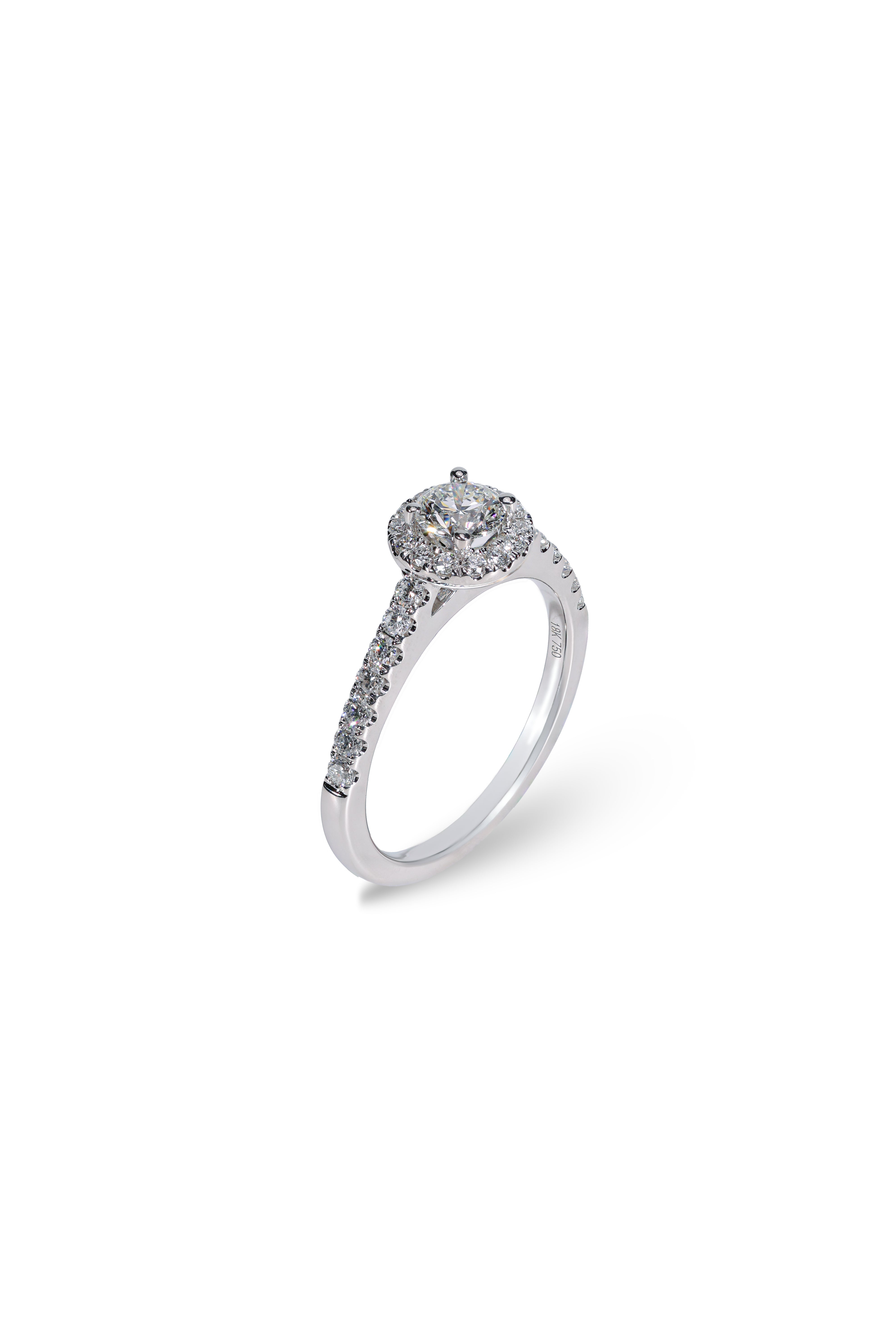 Angled view of the diamond halo engagement ring in 18K white gold.